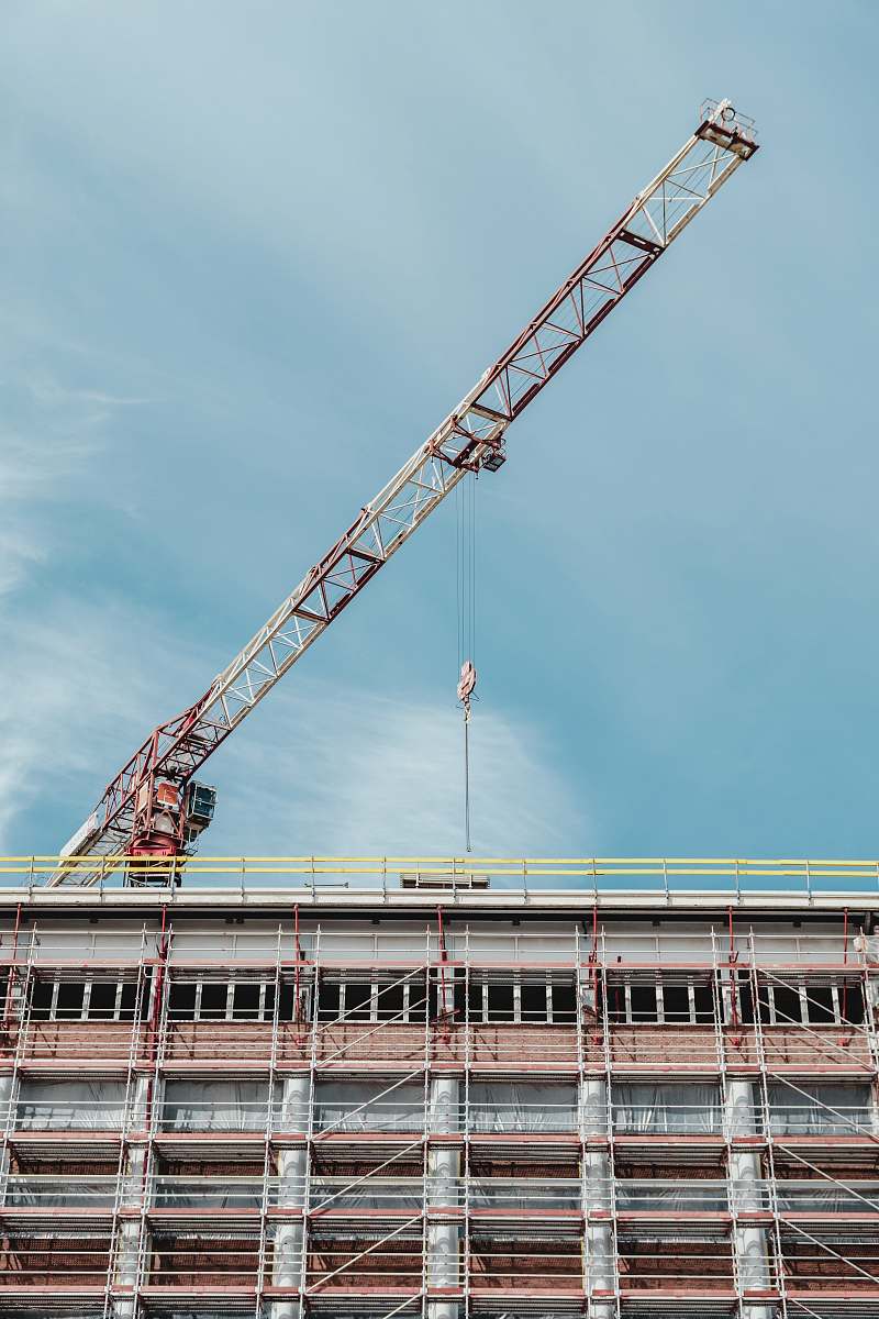 leuven gray and brown crane on top of building belgium